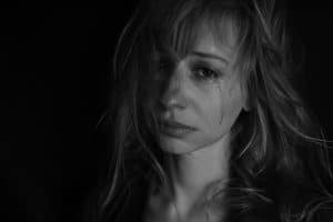 What is hypnotherapy used for? Alleviating pain. A woman crying. 