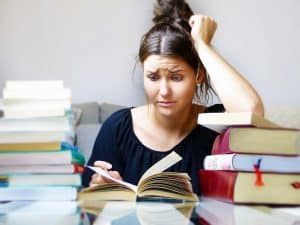 What is hypnotherapy used for? Alleviating stress Woman with books