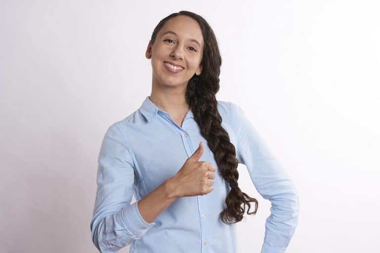 Hypnotherapists can help improve mental health - woman looking happy