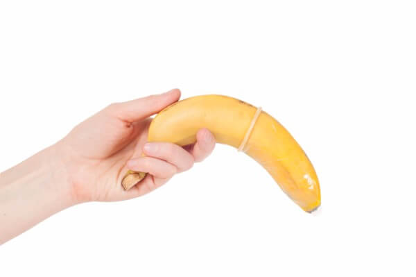 Hand holding a banana. Boundaries.
