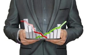 Work-life balance challenge performance - man holding graph