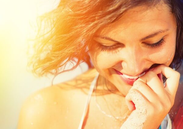 woman smiling as she has Unconditional positive regard for herself