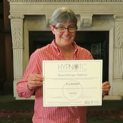 Hypnotherapy graduate, holding the hypnotherapy diploma certificate.