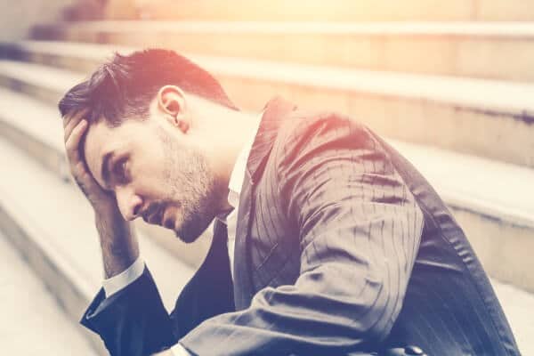 man overwhelmed stairs office suit business workplace stress