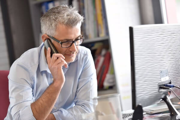 hypnotherapist client contact checkup update progress man working computer phone mobile job
