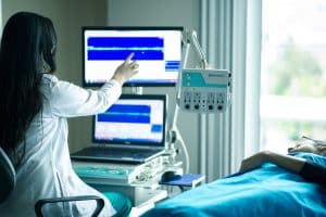 Clinician and medical equipment - hypnotherapy training for healthcare professionals