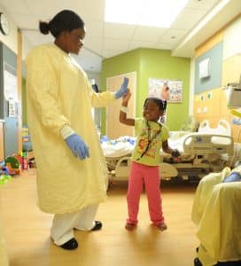 Nurse with child - hypnotherapy training for healthcare professionals