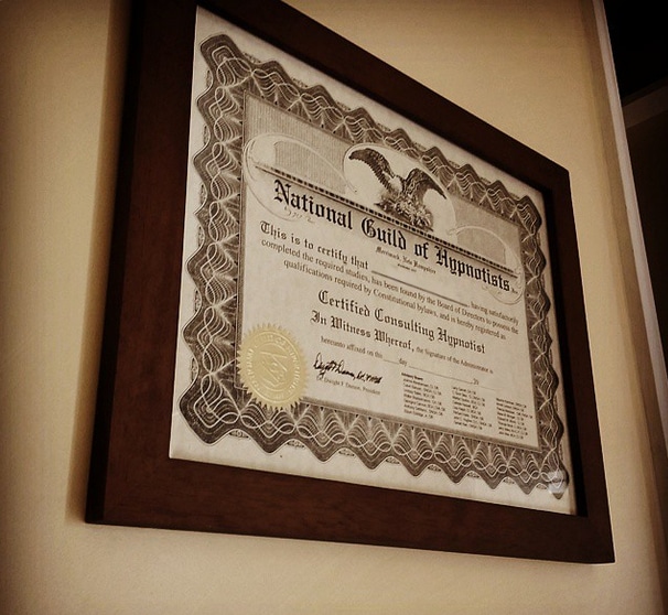 Hypnotherapy training course NGH Certificate in a brown frame