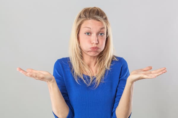 Hypnotherapy script woman in blue shrugging and looking confused